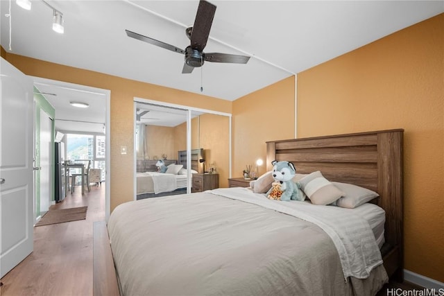 2211 Ala Wai Blvd Unit 2414, Honolulu, HI 96815 - bedroom featuring light wood-style floors, a closet, and ceiling fan