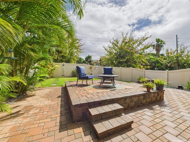 view of patio / terrace with a fenced backyard and a gate