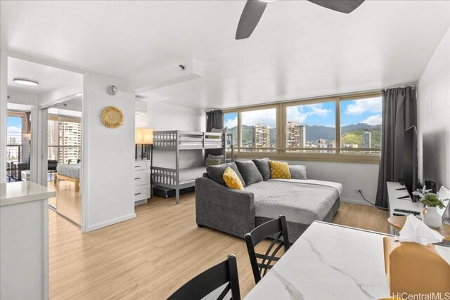 bedroom with light wood-style floors and baseboards