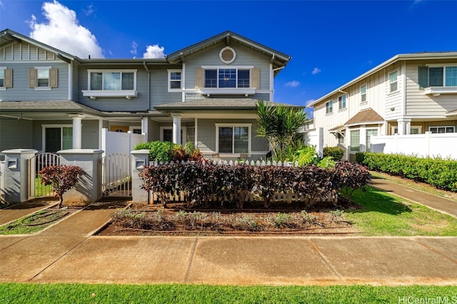 multi unit property featuring a gate and fence