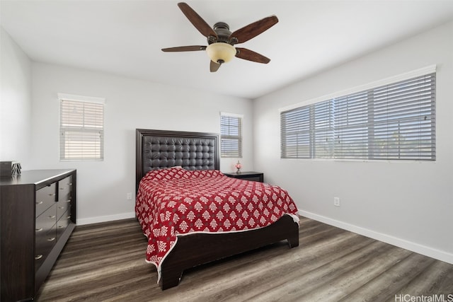 bedroom with dark wood finished floors, baseboards, and ceiling fan