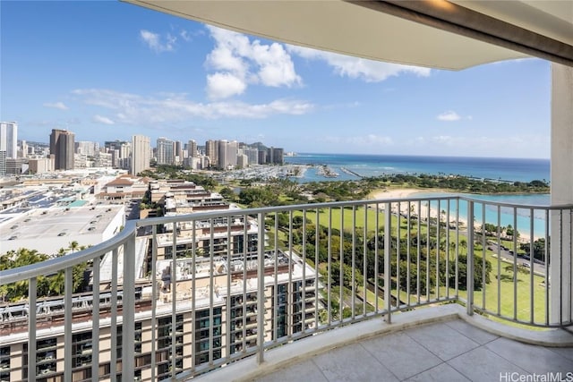 balcony featuring a view of city and a water view