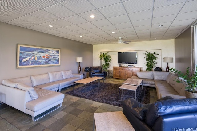 living area featuring ceiling fan, recessed lighting, and a paneled ceiling