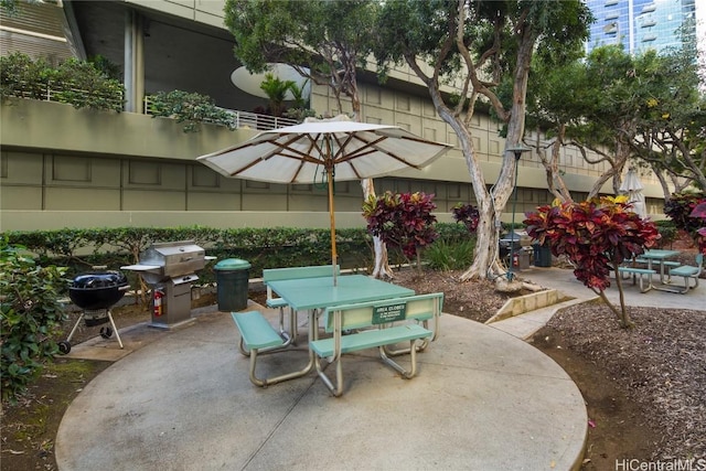 view of patio / terrace featuring area for grilling and outdoor dining area