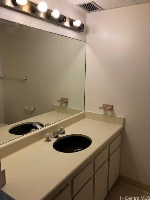 bathroom featuring vanity and visible vents