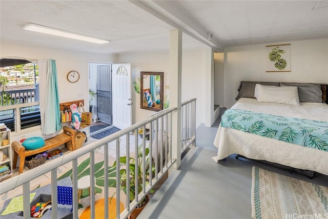 bedroom featuring concrete floors