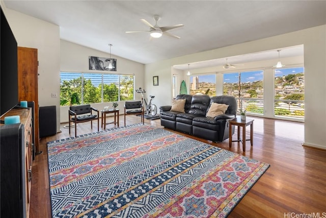 living room with vaulted ceiling, a ceiling fan, and wood finished floors