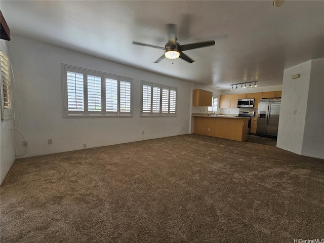 95-1007 Maalewa St, Mililani, HI 96789 - unfurnished living room featuring dark colored carpet, a ceiling fan, and rail lighting