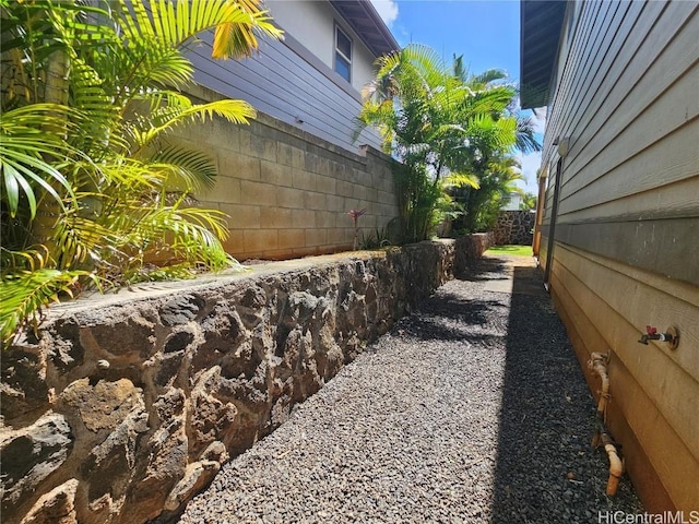 view of home's exterior featuring fence