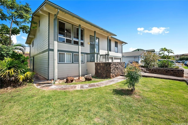 view of property exterior with a lawn