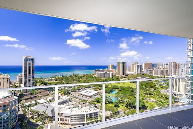 balcony featuring a view of city and a water view