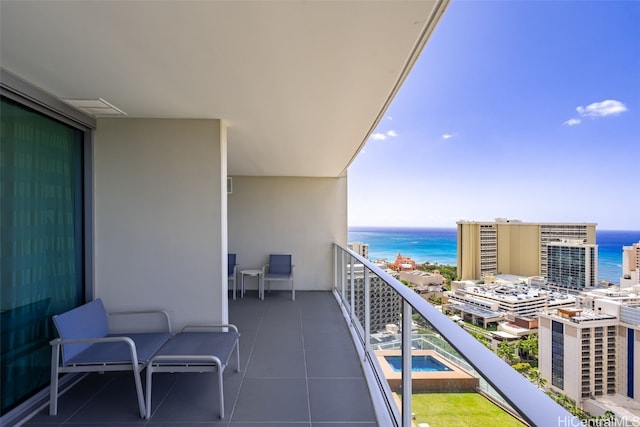 balcony featuring a water view