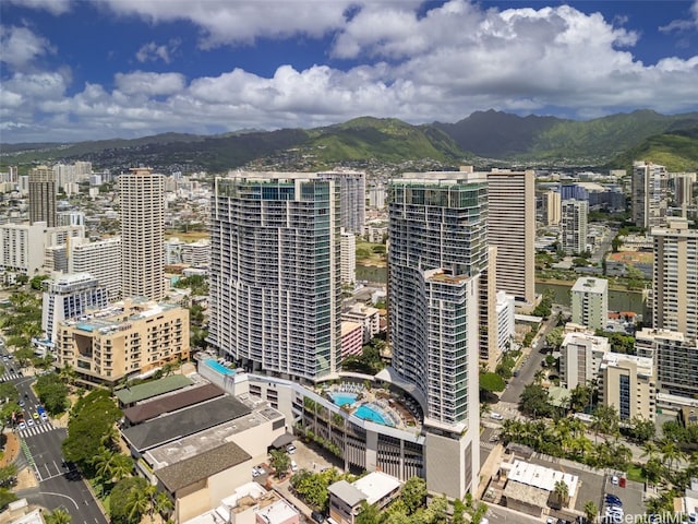 property's view of city with a mountain view