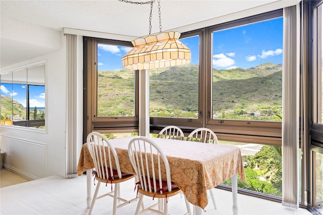 531 Hahaione St Unit 2-9A, Honolulu, HI 96825 - dining area with plenty of natural light, baseboards, and a mountain view