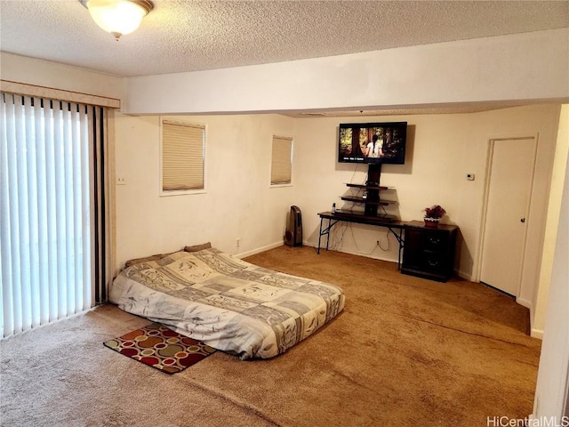 carpeted bedroom with a textured ceiling