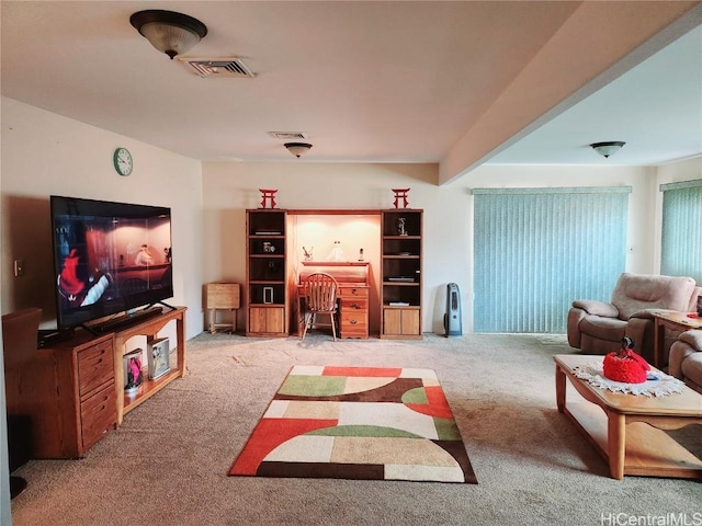 carpeted living area with visible vents