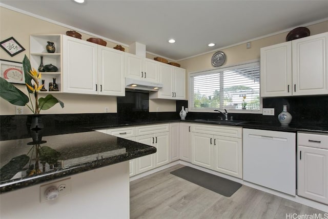 kitchen featuring open shelves, white dishwasher, a sink, under cabinet range hood, and white cabinetry