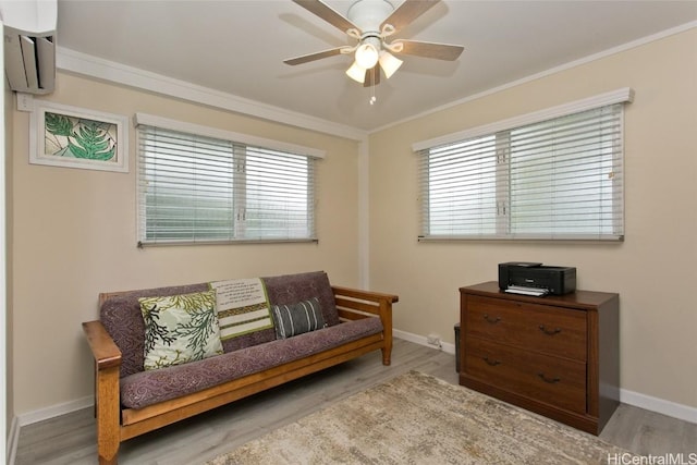 sitting room featuring crown molding, ceiling fan, and wood finished floors