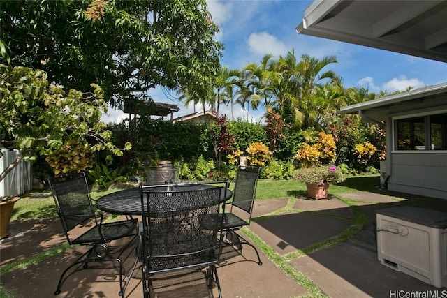 view of patio / terrace featuring outdoor dining space and fence