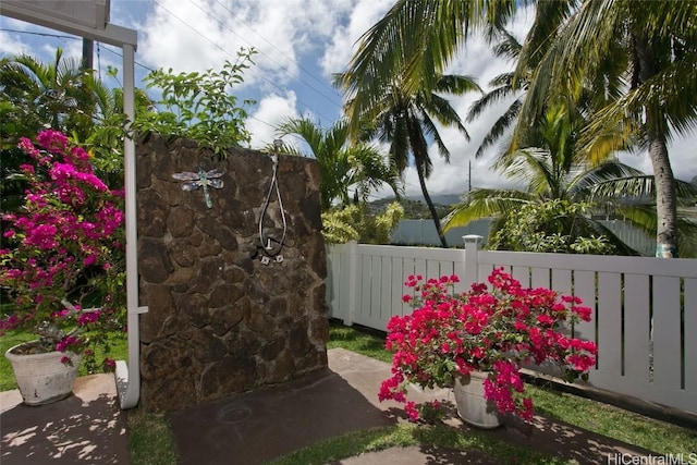 view of gate with fence