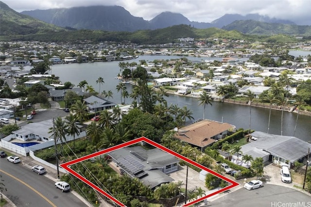 birds eye view of property featuring a residential view and a water and mountain view