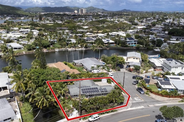 drone / aerial view with a residential view and a water and mountain view