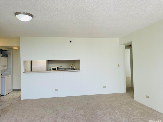 3130 Ala Ilima St Unit 18C, Honolulu, HI 96818 - unfurnished living room with light colored carpet and a textured ceiling