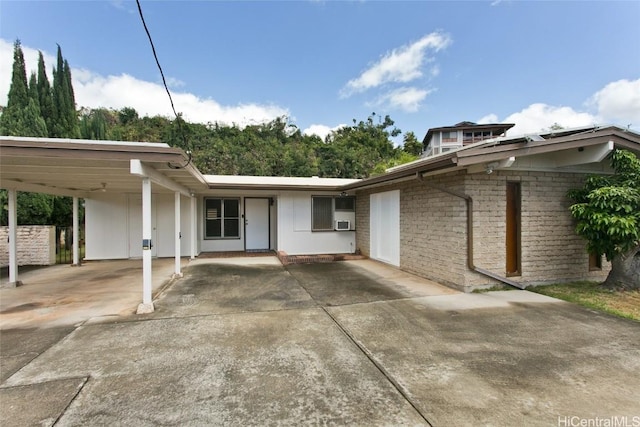 view of front of house with a carport and brick siding