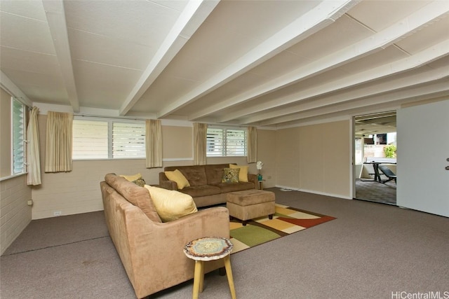 living room with beamed ceiling and carpet