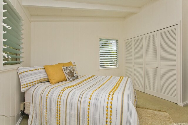 99-776 Aliipoe Dr, Aiea, HI 96701 - carpeted bedroom featuring beam ceiling and a closet