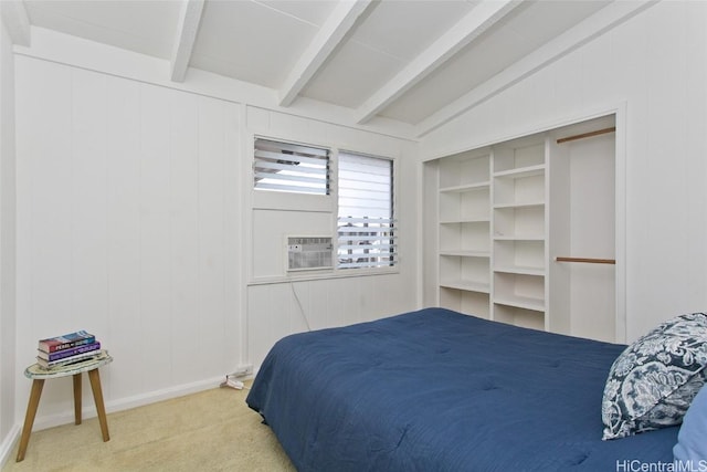 carpeted bedroom featuring lofted ceiling with beams