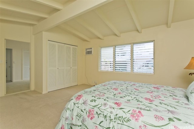 bedroom with a closet, lofted ceiling with beams, and carpet