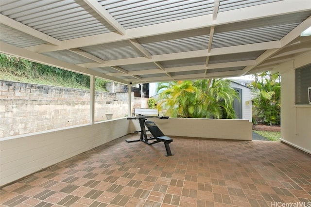 view of patio / terrace featuring an outdoor structure and a shed