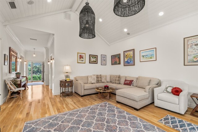 living area featuring visible vents, crown molding, wood finished floors, high vaulted ceiling, and recessed lighting