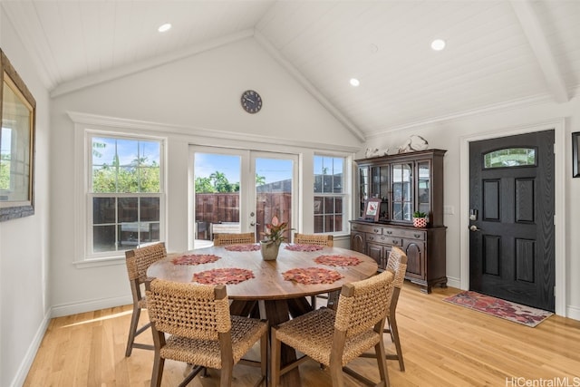 dining area with recessed lighting, baseboards, light wood-type flooring, and high vaulted ceiling