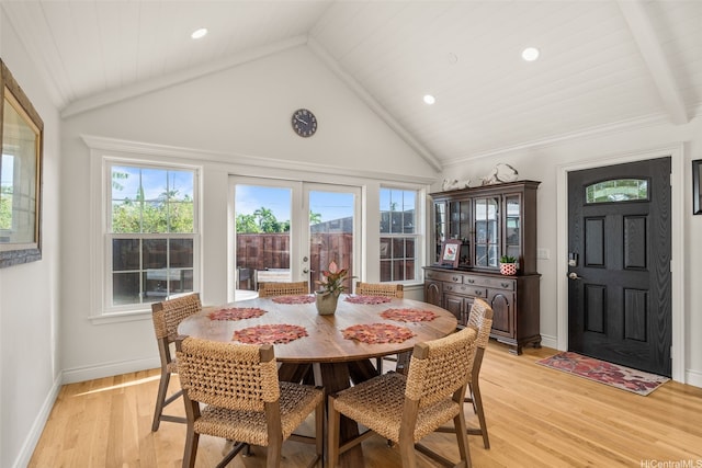 dining space featuring recessed lighting, vaulted ceiling, plenty of natural light, and light wood-type flooring