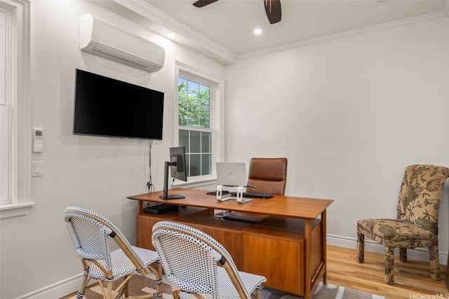 office space featuring a ceiling fan, wood finished floors, baseboards, an AC wall unit, and ornamental molding