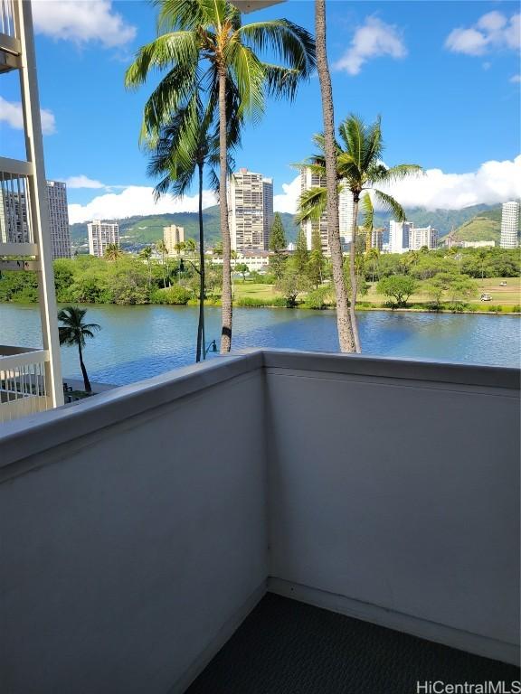 balcony featuring a water view