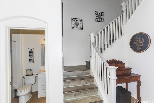 staircase featuring wood finished floors