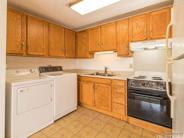 kitchen with light countertops, black range with electric stovetop, a sink, washer and dryer, and under cabinet range hood