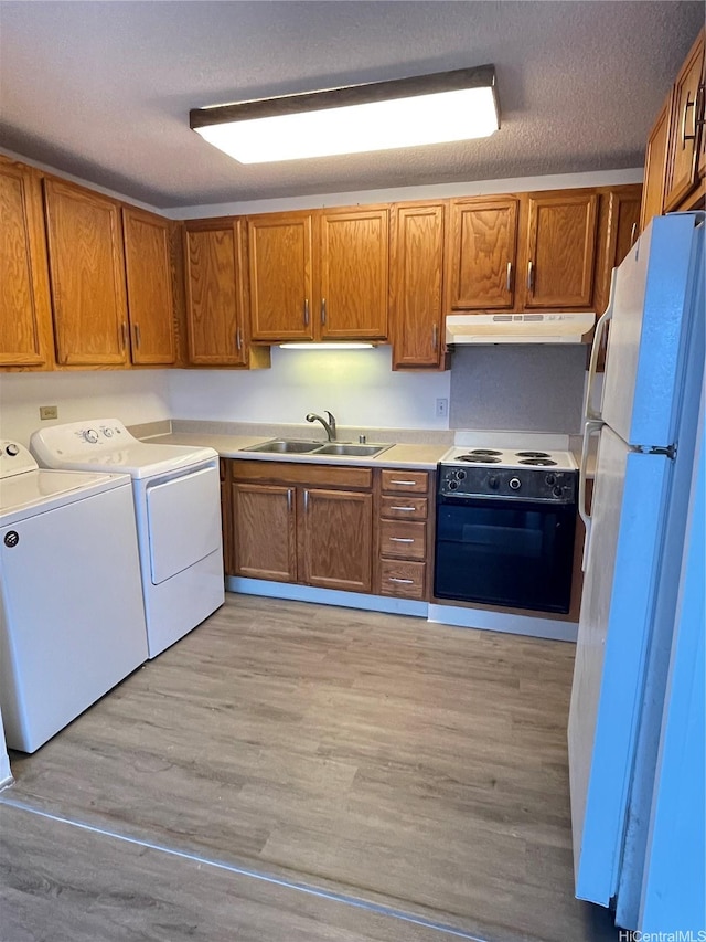 1710 Punahou St Unit 305, Honolulu, HI 96822 - kitchen with independent washer and dryer, freestanding refrigerator, a sink, electric range oven, and under cabinet range hood