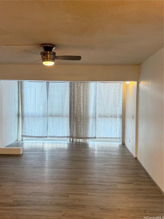 1710 Punahou St Unit 305, Honolulu, HI 96822 - empty room with wood finished floors and a ceiling fan