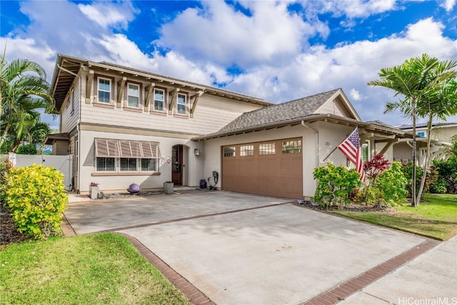 view of front facade featuring concrete driveway, an attached garage, fence, and stucco siding