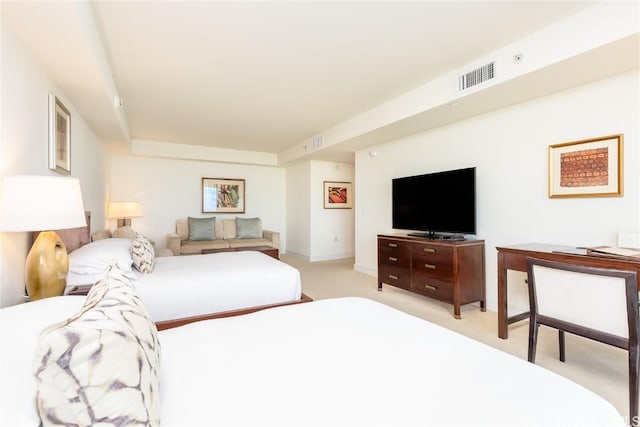 bedroom featuring light carpet and visible vents