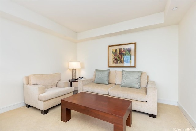 living area with light carpet and baseboards