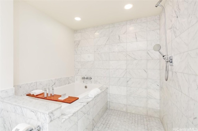 full bath featuring a tile shower, a bath, and recessed lighting