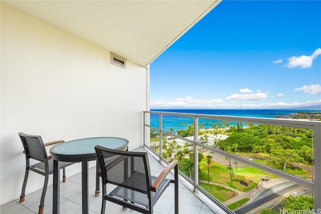 balcony featuring a water view