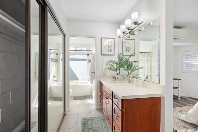 full bathroom featuring curtained shower, wood finished floors, vanity, a wall mounted air conditioner, and a bathtub