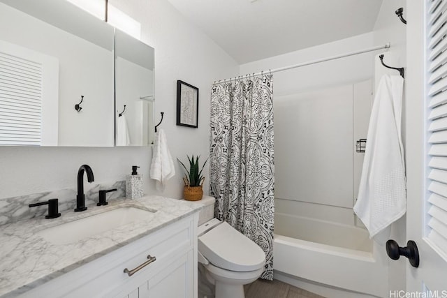 full bathroom featuring shower / tub combo with curtain, vanity, and toilet