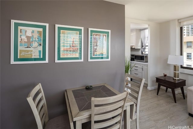 dining room with light wood-type flooring